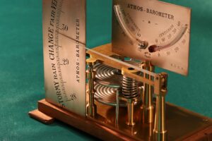 Close up of dials and movement of French Atmos Barometer c1875