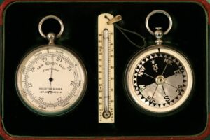Image of the inside of Houghton & Gunn Silver Travel Compendium c1895 showing pocket barometer, thermometer and compass