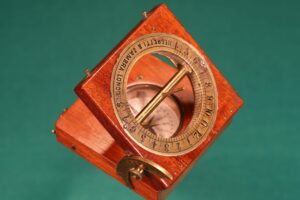 Image of open Francis Barker Equinoctial Compass Retailed by Negretti & Zambra c1870 with gnomon raised taken from above