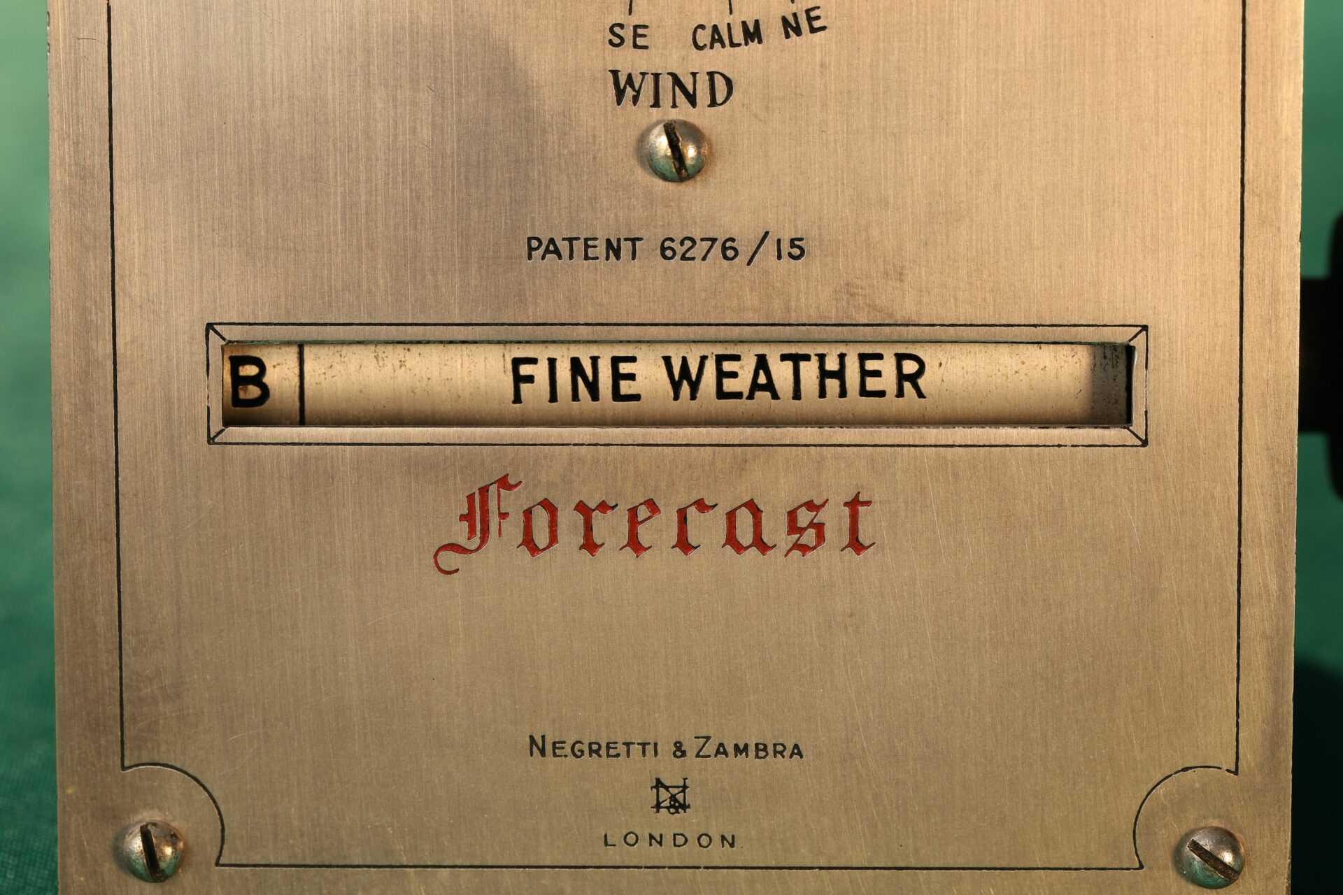 Close up of Forecast window of Negretti & Zambra Desk Forecaster c1915