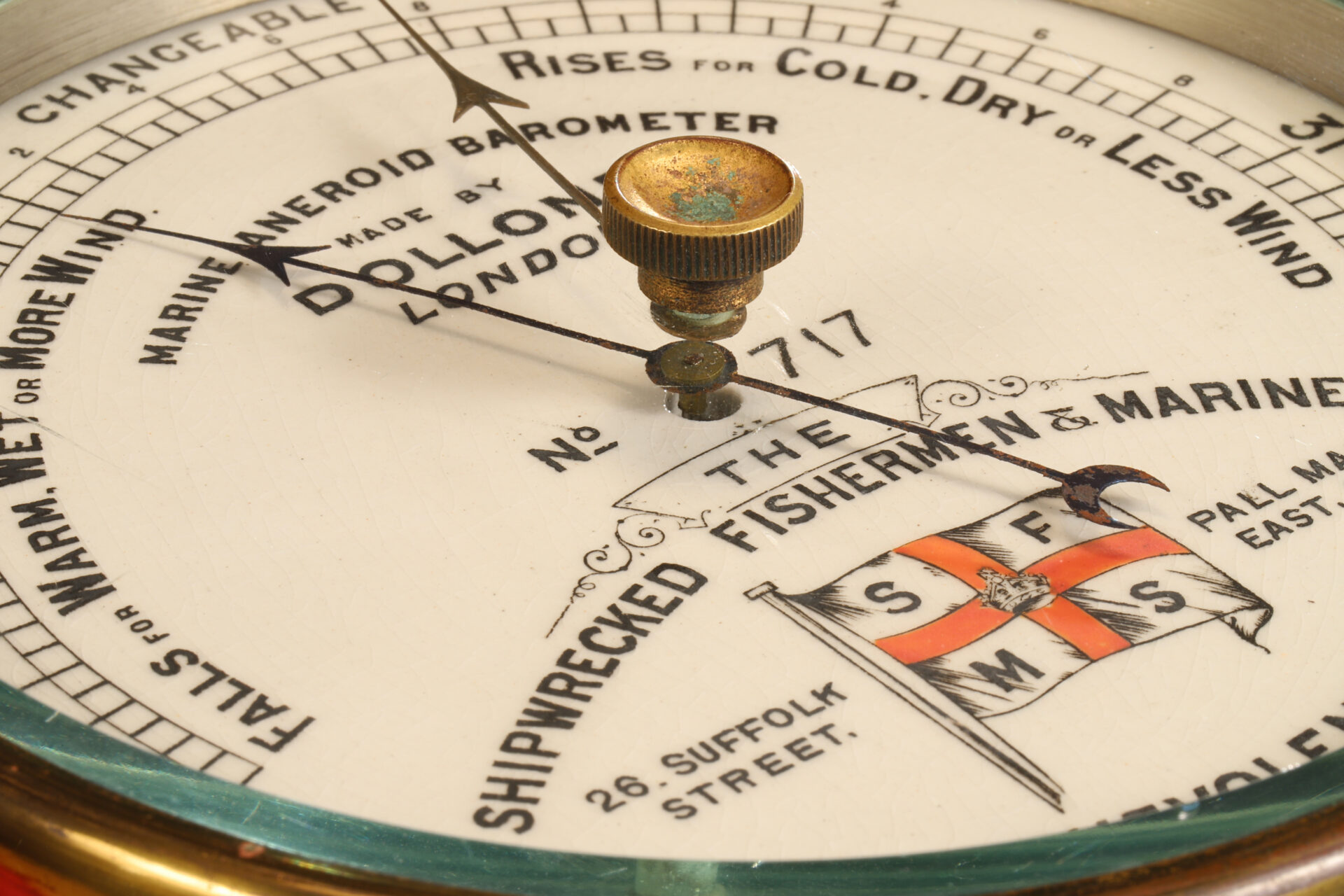 Close up of dial from Dollond Shipwrecked Mariners Society Barometer No 717 c1895 taken from lefthand side and showing bevelled glass