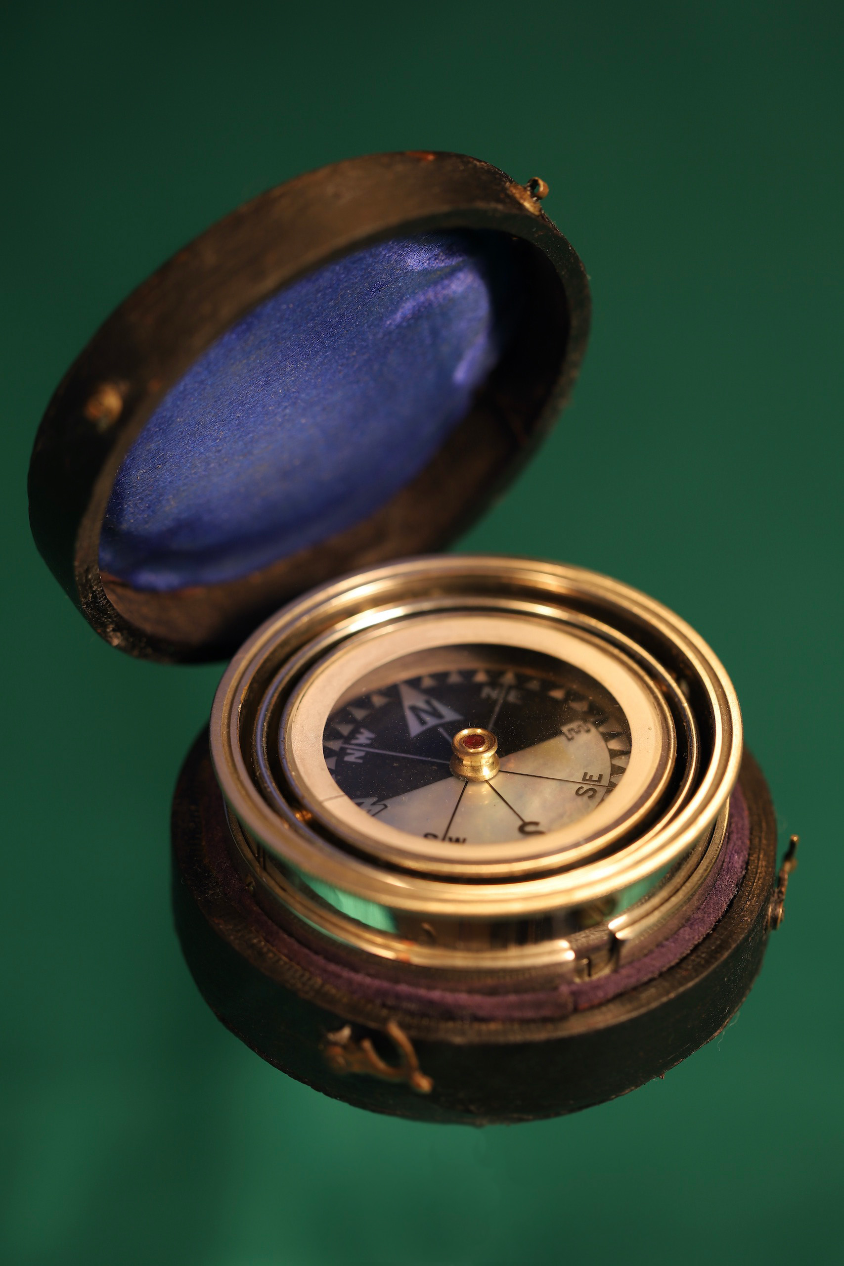 Main image of gimballed compass showing the compass part extended out of its case